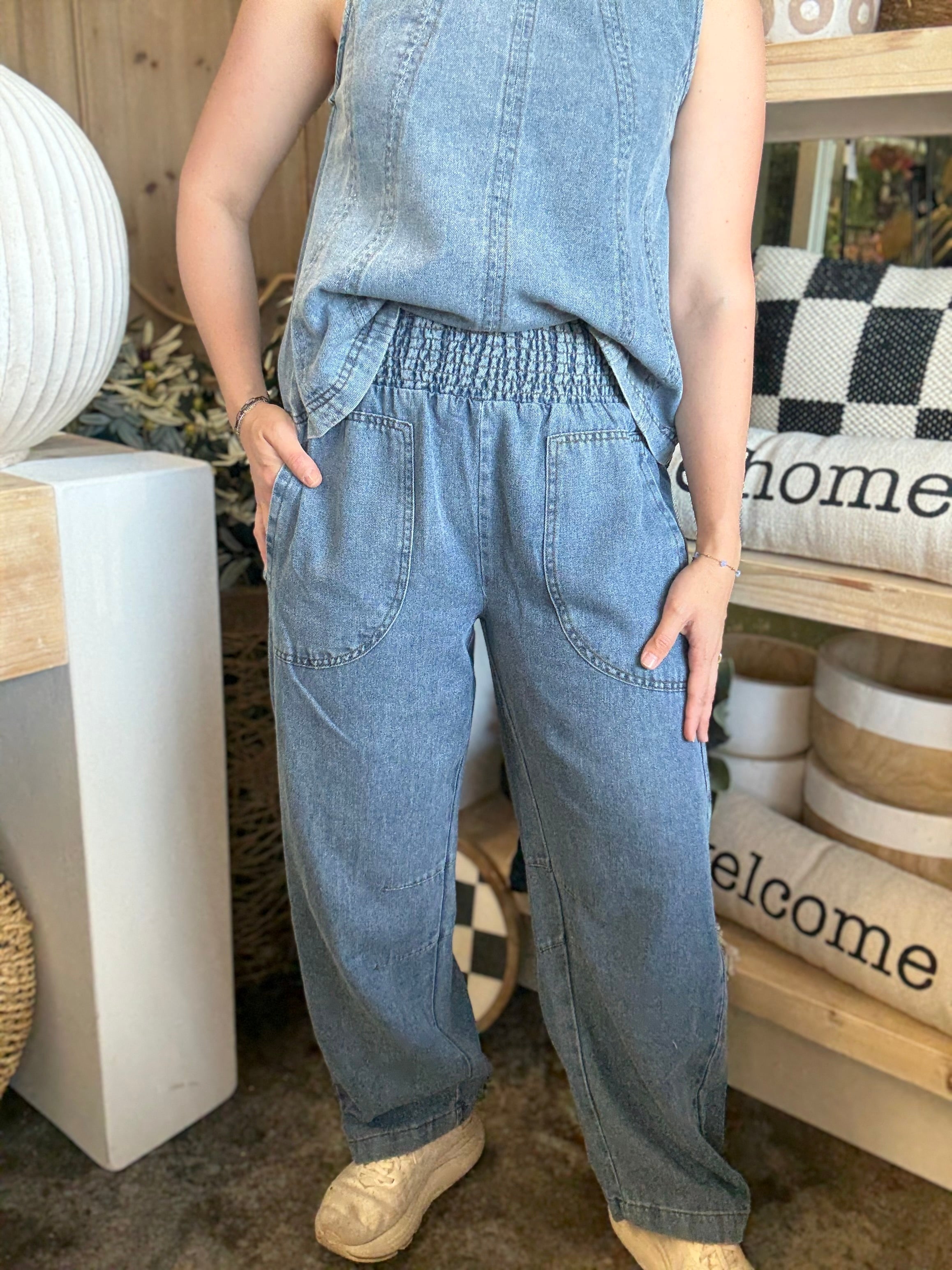 women's blue denim barrel pants with smocked waistband and oversized patch pockets