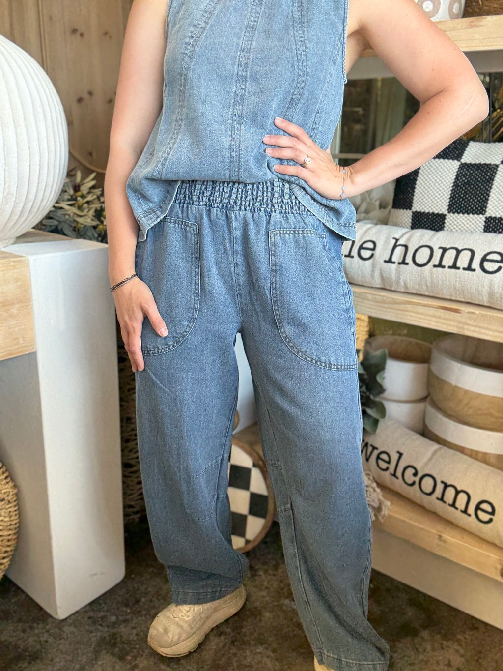 women's blue denim barrel pants with smocked waistband and oversized patch pockets
