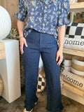 indigo pull-on pants with front patch pockets and ruffle hem detail