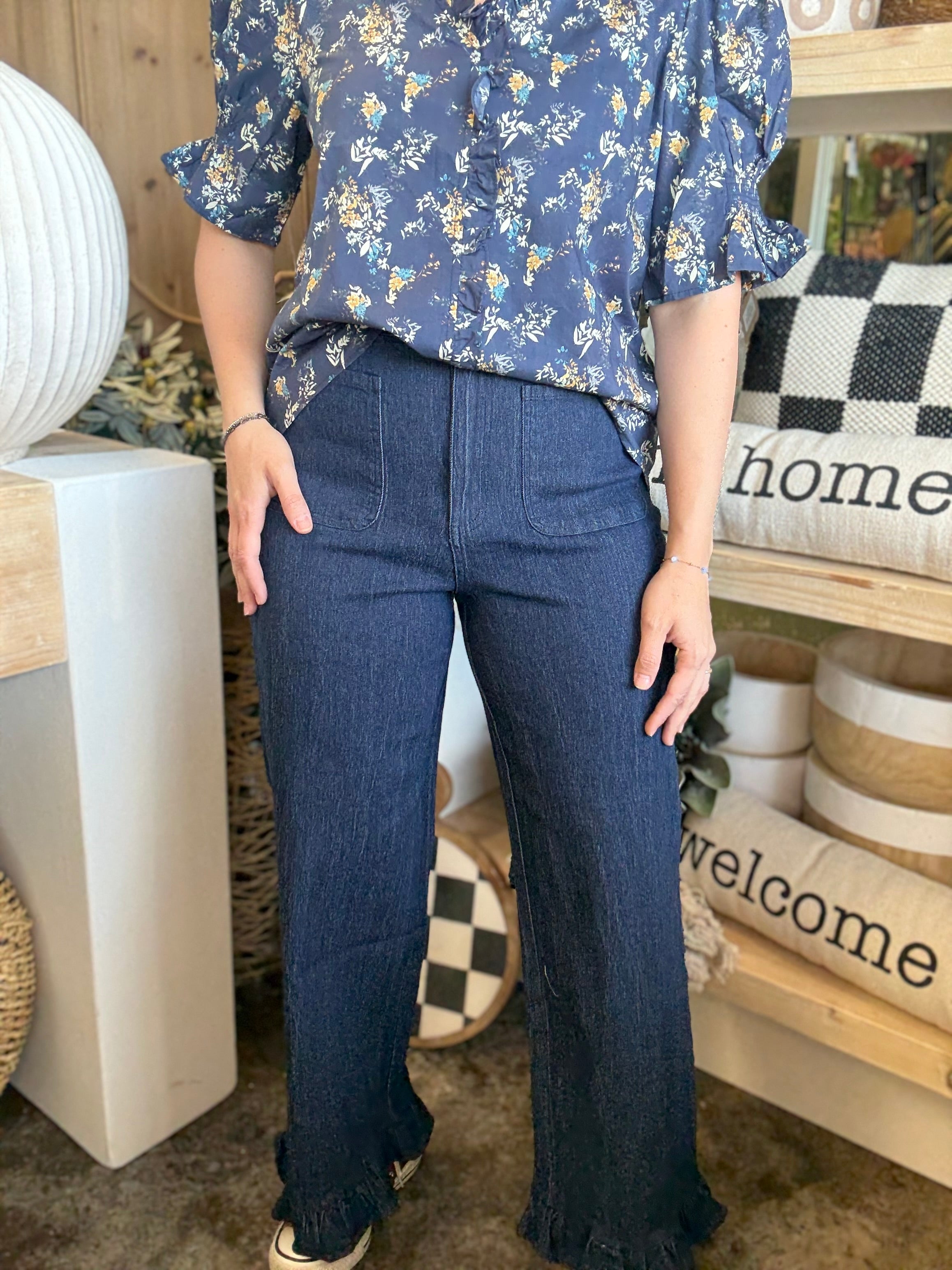 indigo pull-on pants with front patch pockets and ruffle hem detail