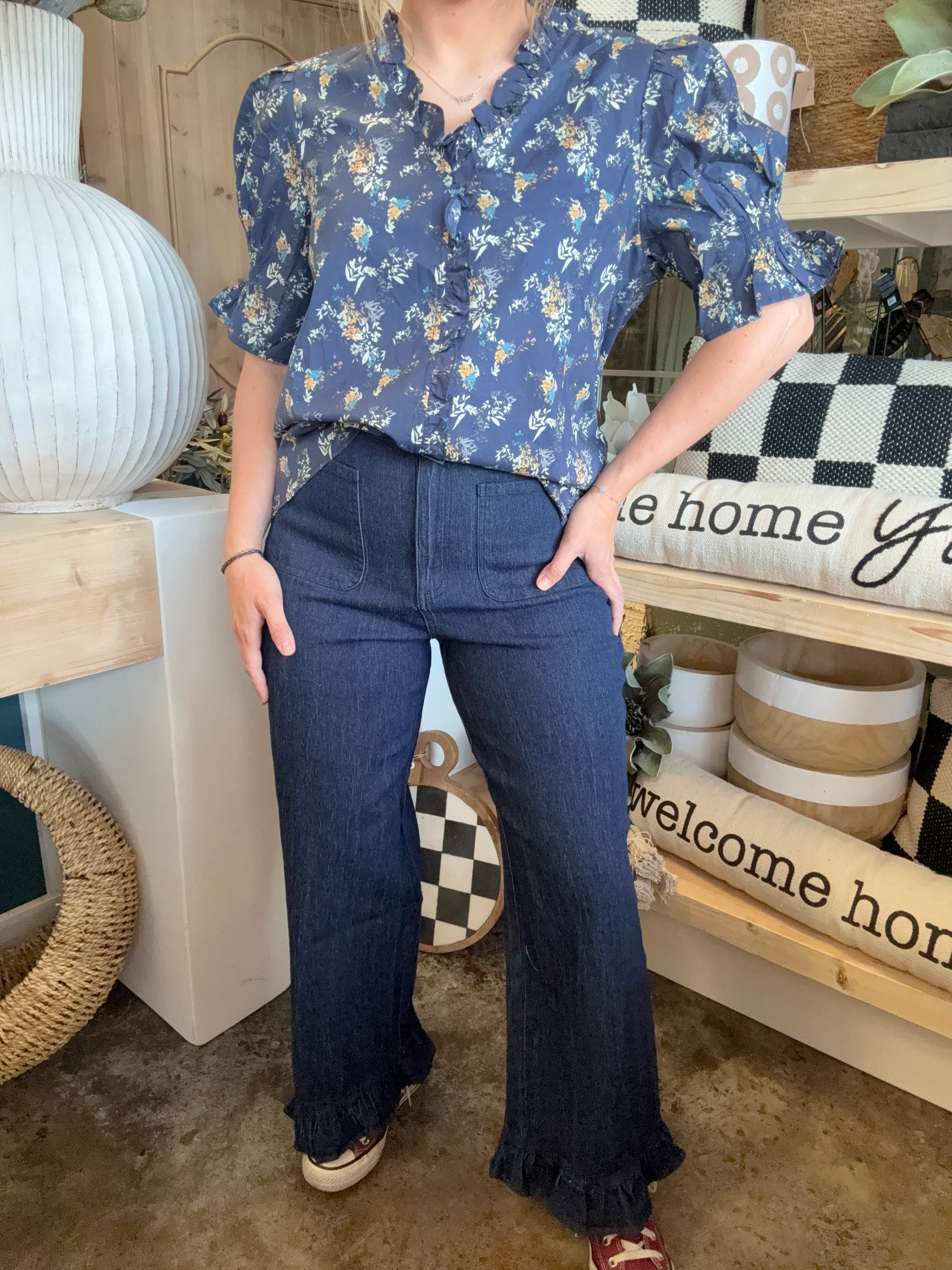 indigo pull-on pants with front patch pockets and ruffle hem detail