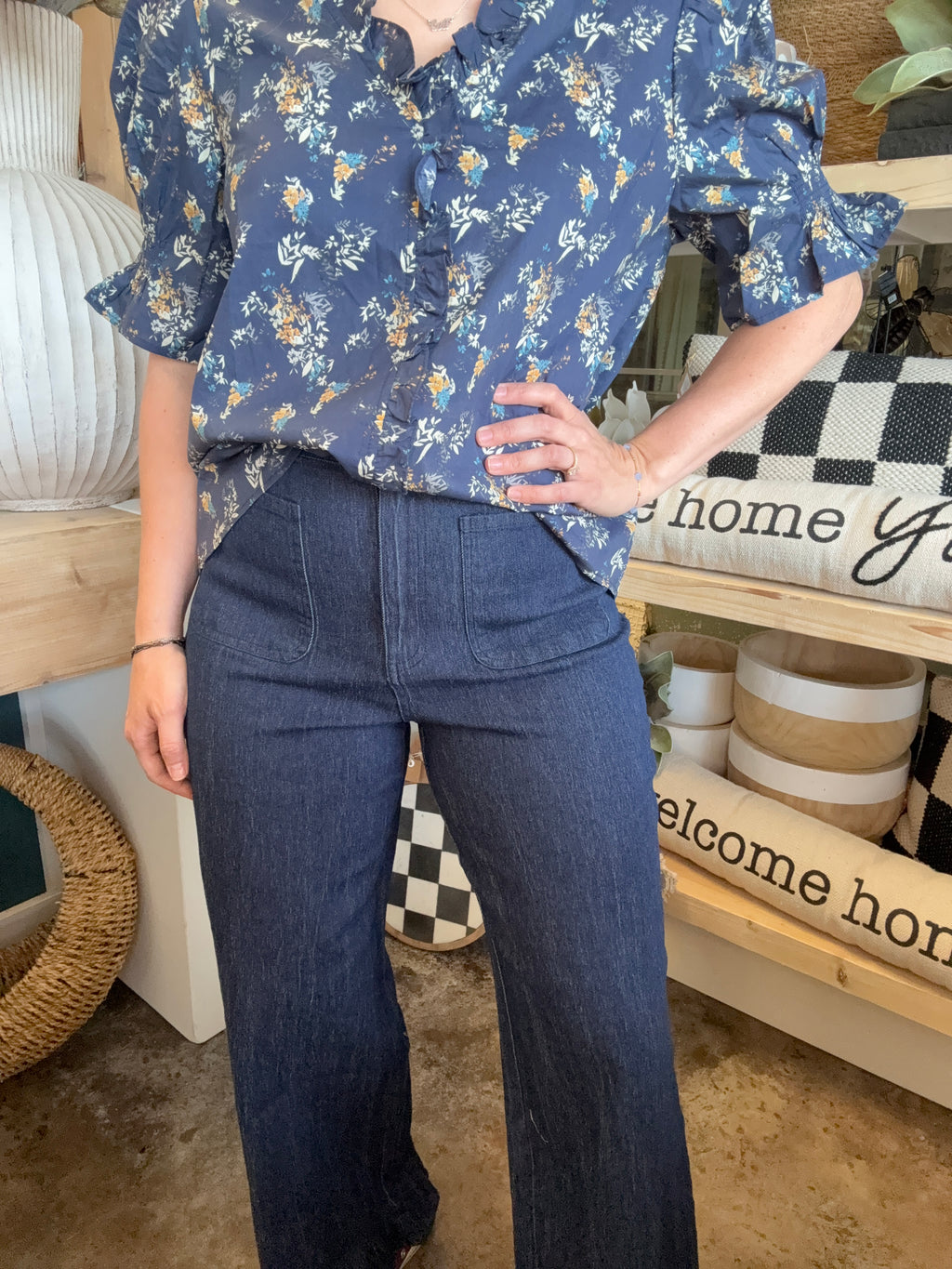 indigo pull-on pants with front patch pockets and ruffle hem detail