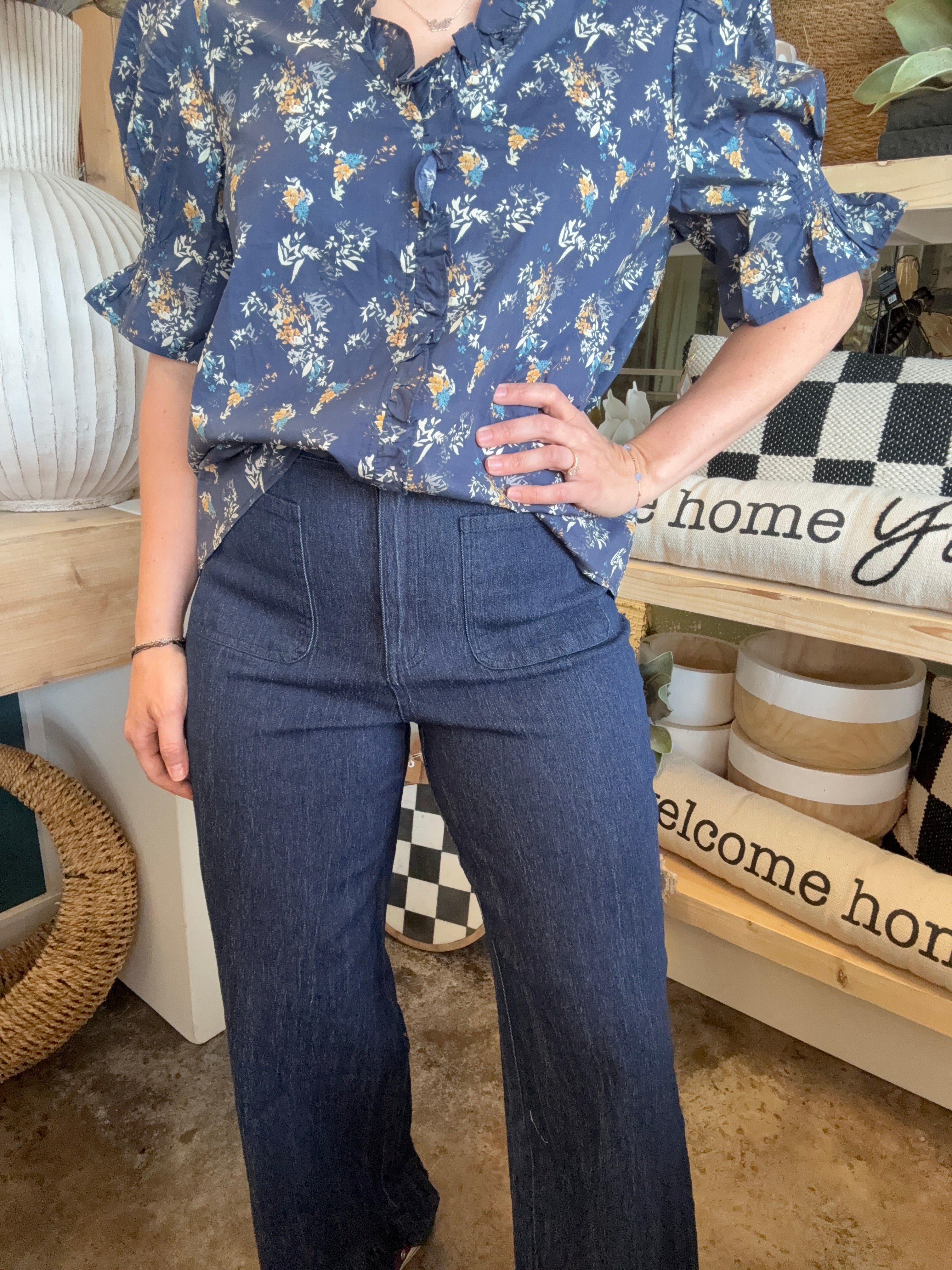 indigo pull-on pants with front patch pockets and ruffle hem detail