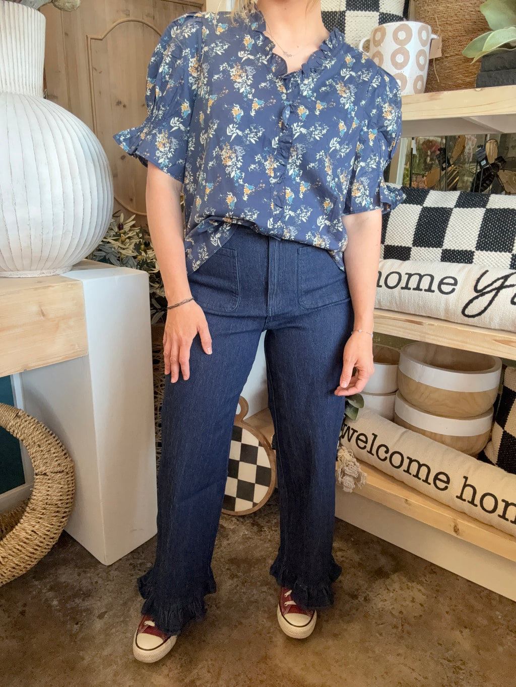 indigo pull-on pants with front patch pockets and ruffle hem detail