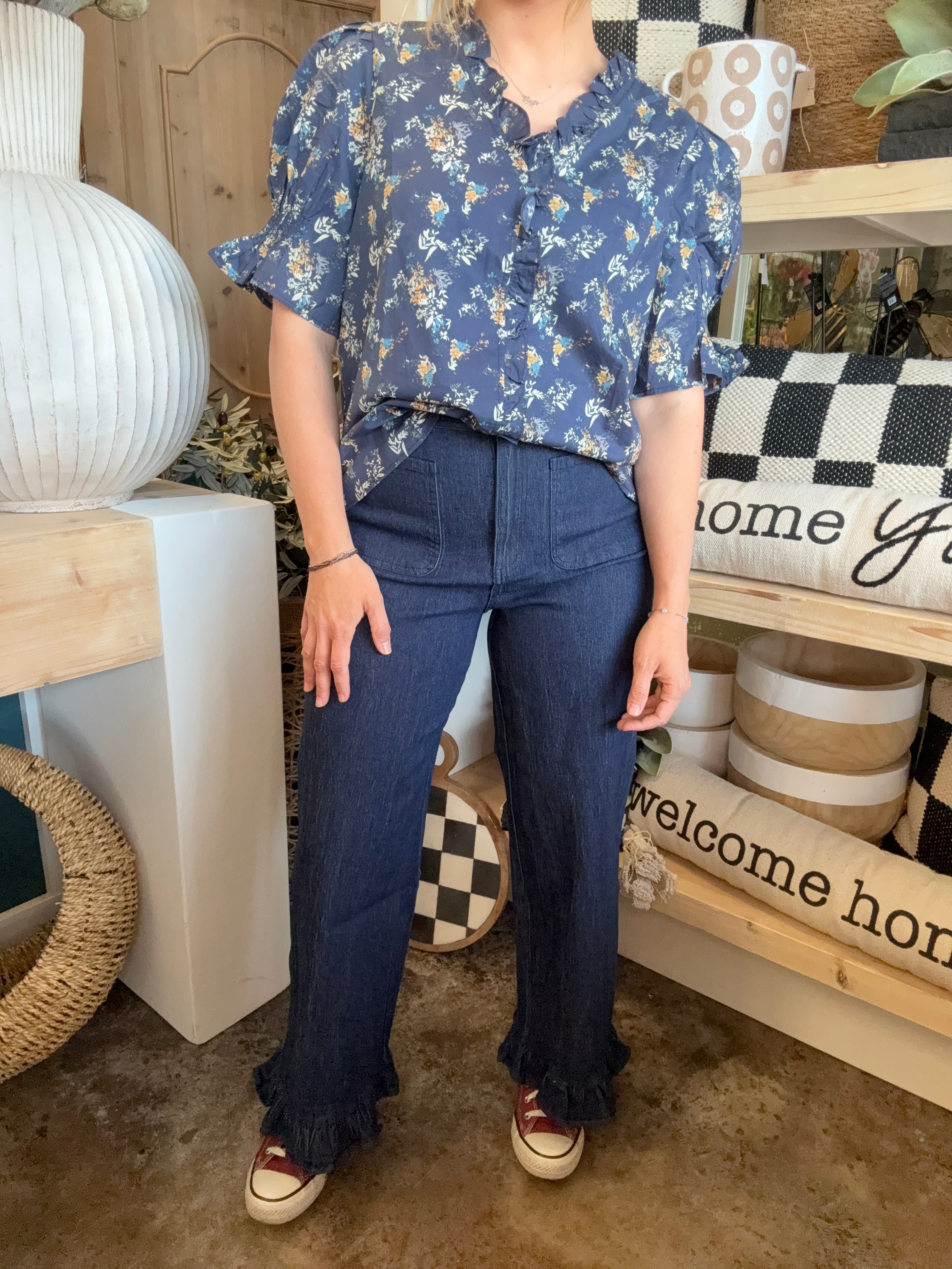indigo pull-on pants with front patch pockets and ruffle hem detail