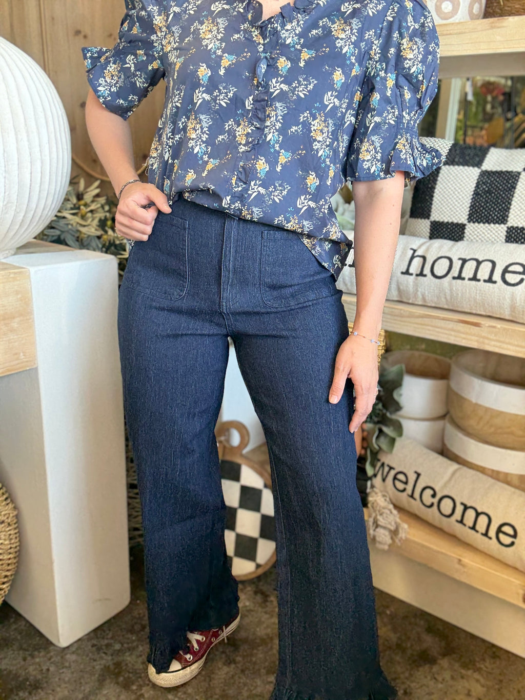 indigo pull-on pants with front patch pockets and ruffle hem detail