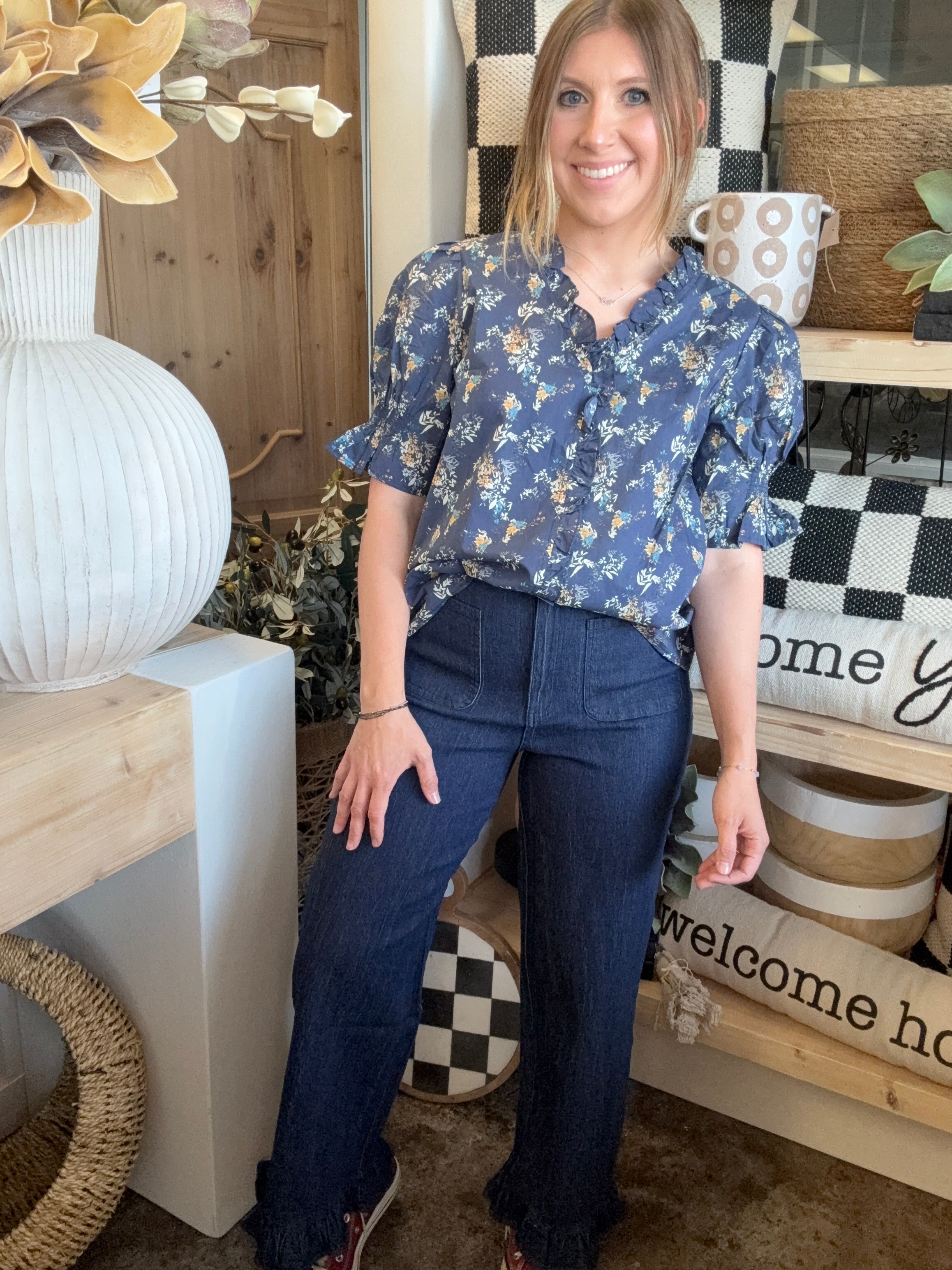 indigo pull-on pants with front patch pockets and ruffle hem detail