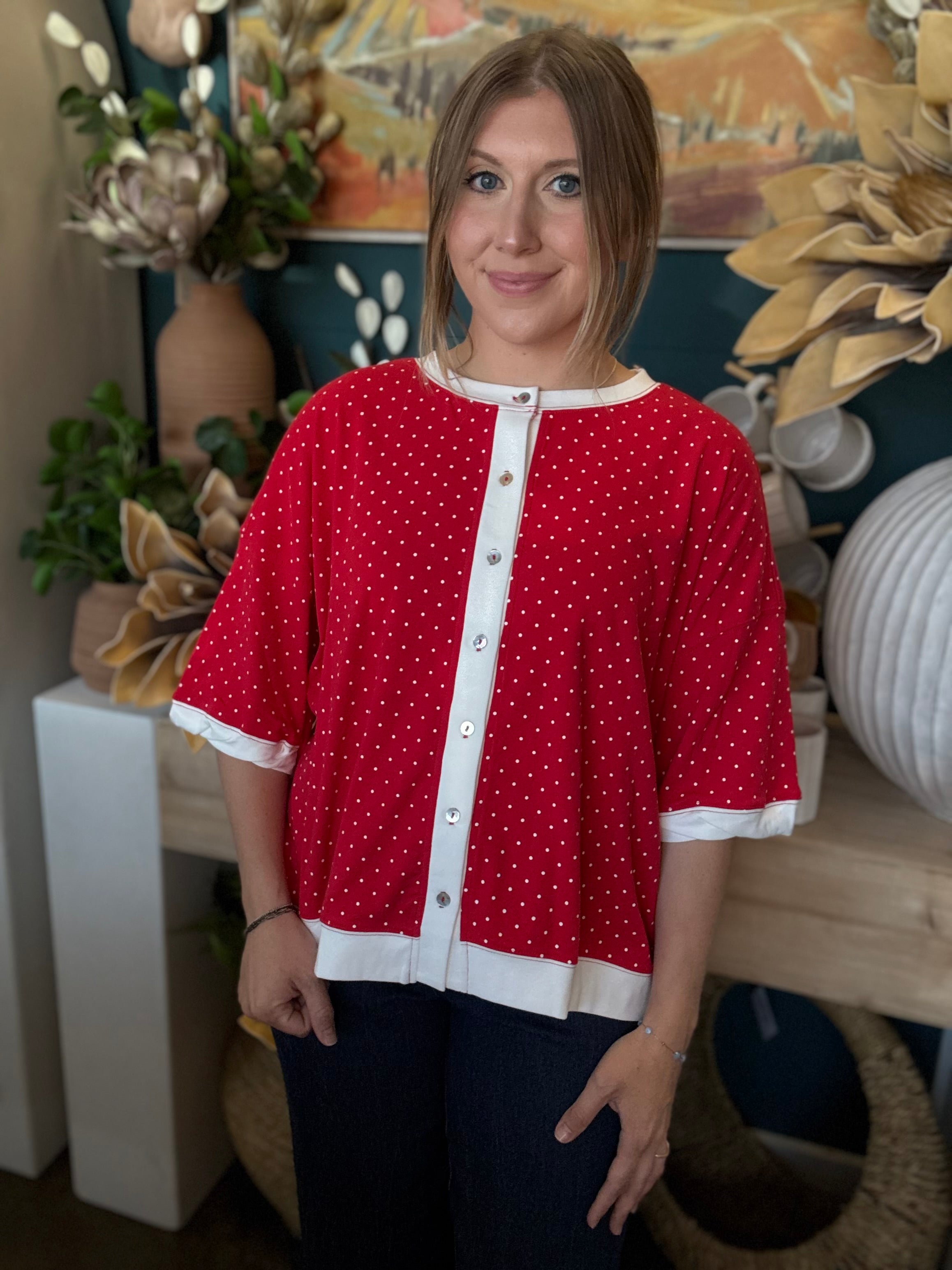 red polka dot oversized button up top with white trim and relaxed fit