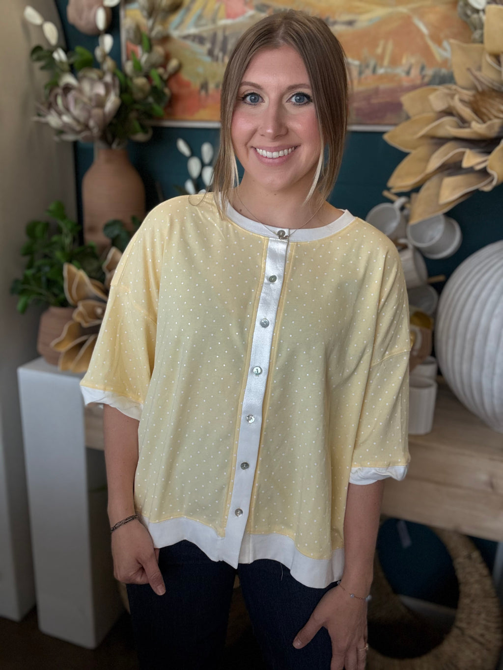 yellow polkadot oversized button up top with balloon sleeves and white trim