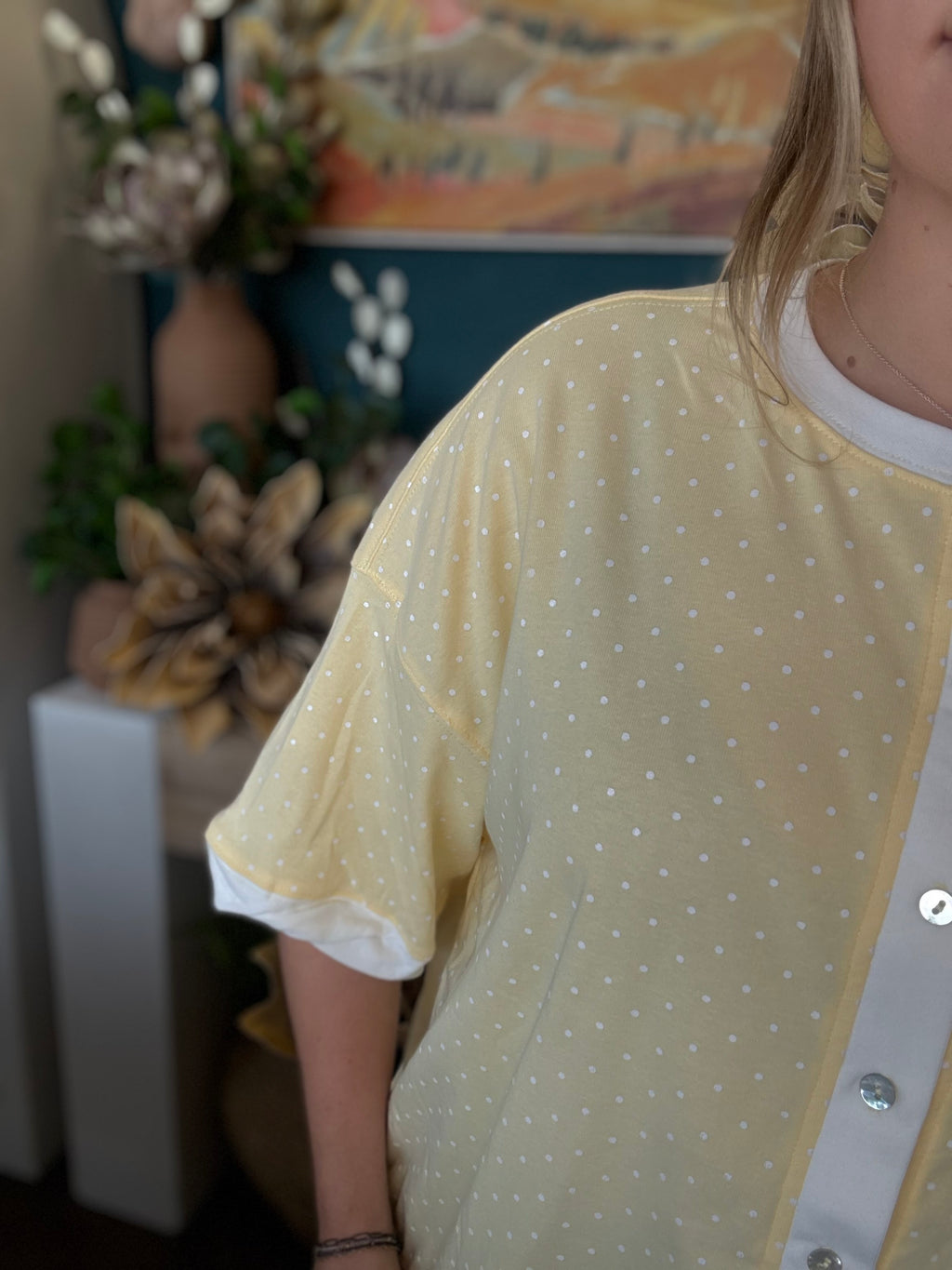 yellow polkadot oversized button up top with balloon sleeves and white trim