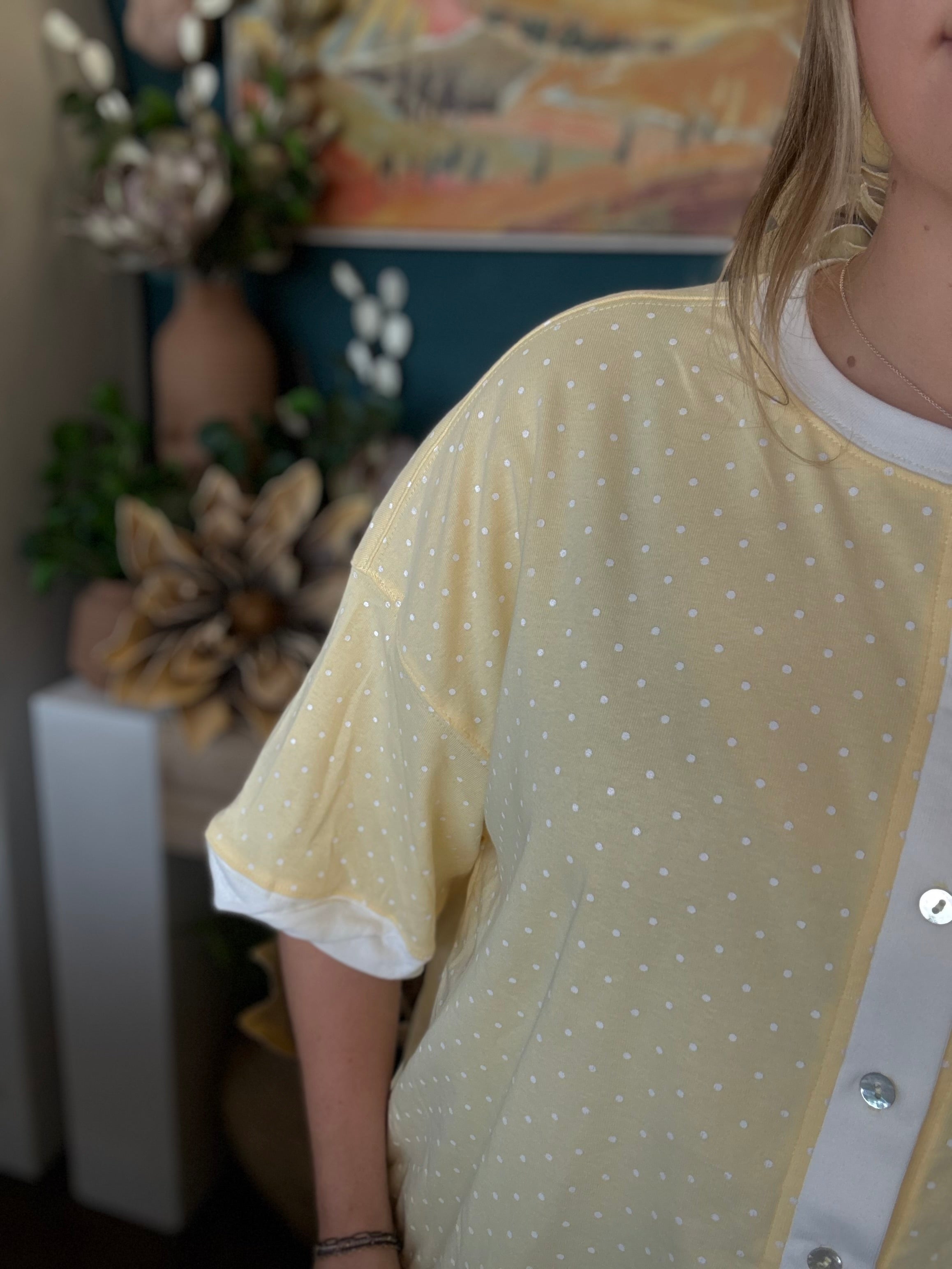 yellow polkadot oversized button up top with balloon sleeves and white trim