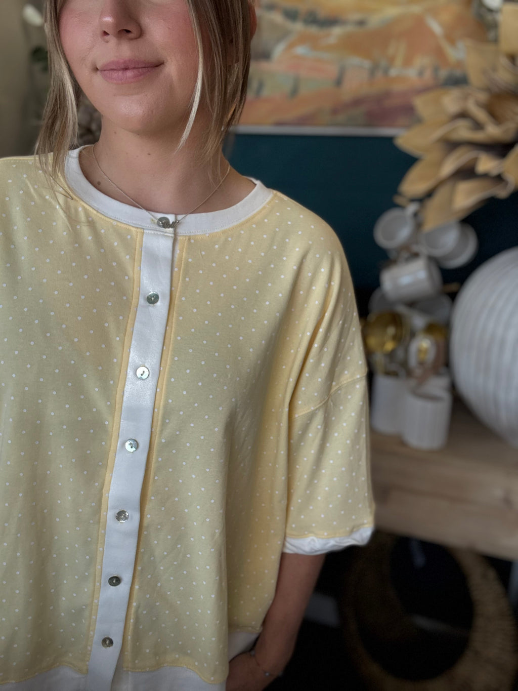 yellow polkadot oversized button up top with balloon sleeves and white trim