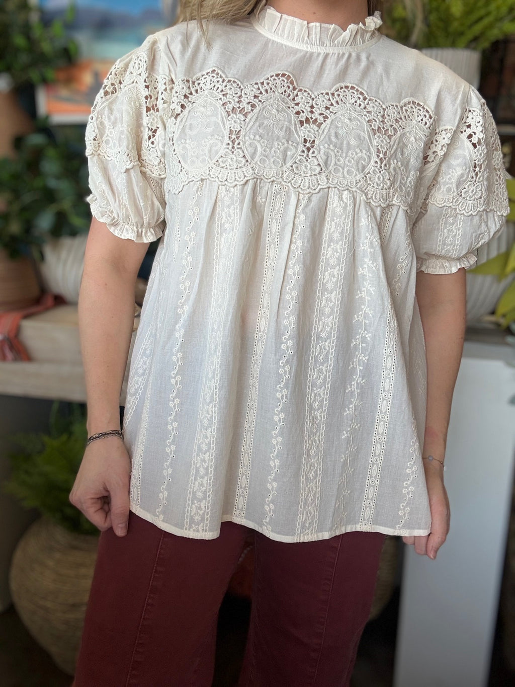 woman wearing vintage lace boutique blouse with mock neck and lace detailing