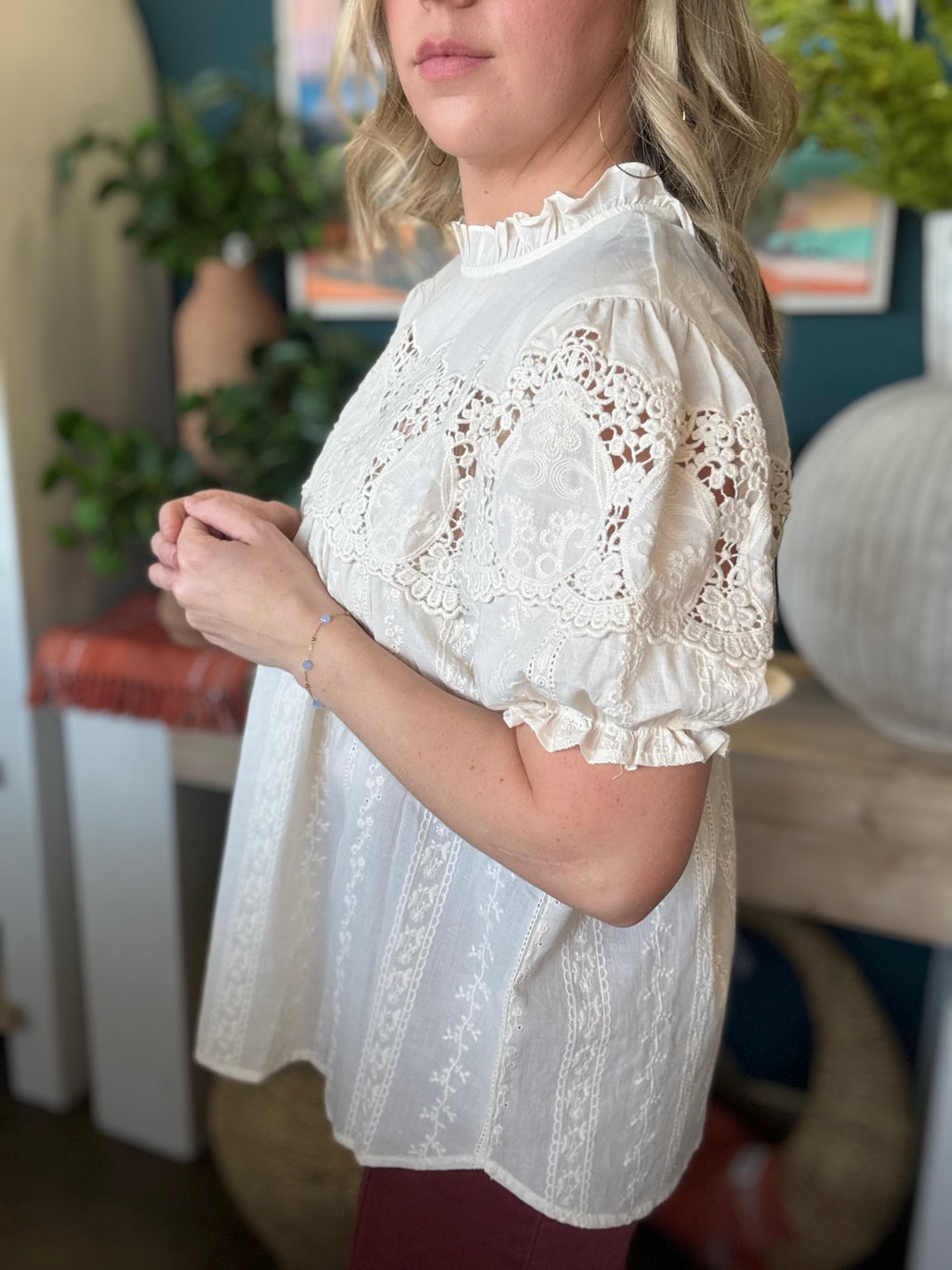 woman wearing vintage lace boutique blouse with mock neck and lace detailing