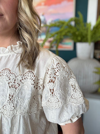 woman wearing vintage lace boutique blouse with mock neck and lace detailing
