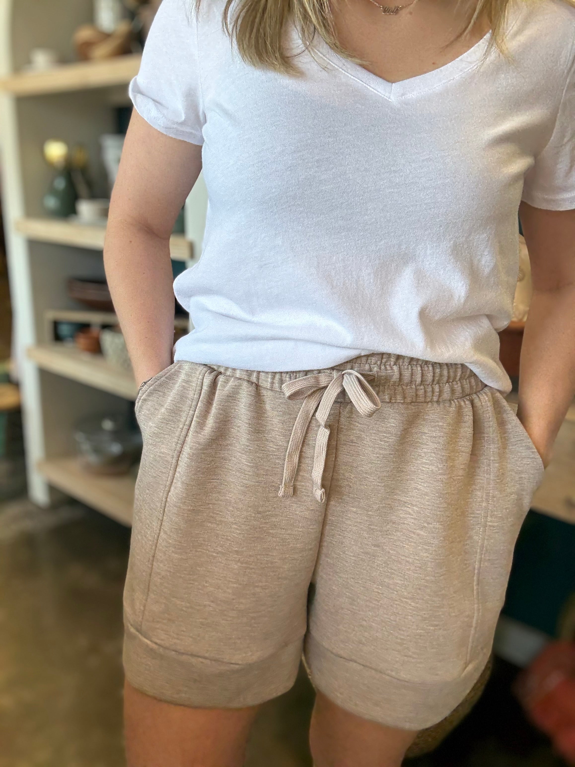 woman wearing neutral drawstring boutique lounge shorts with pockets
