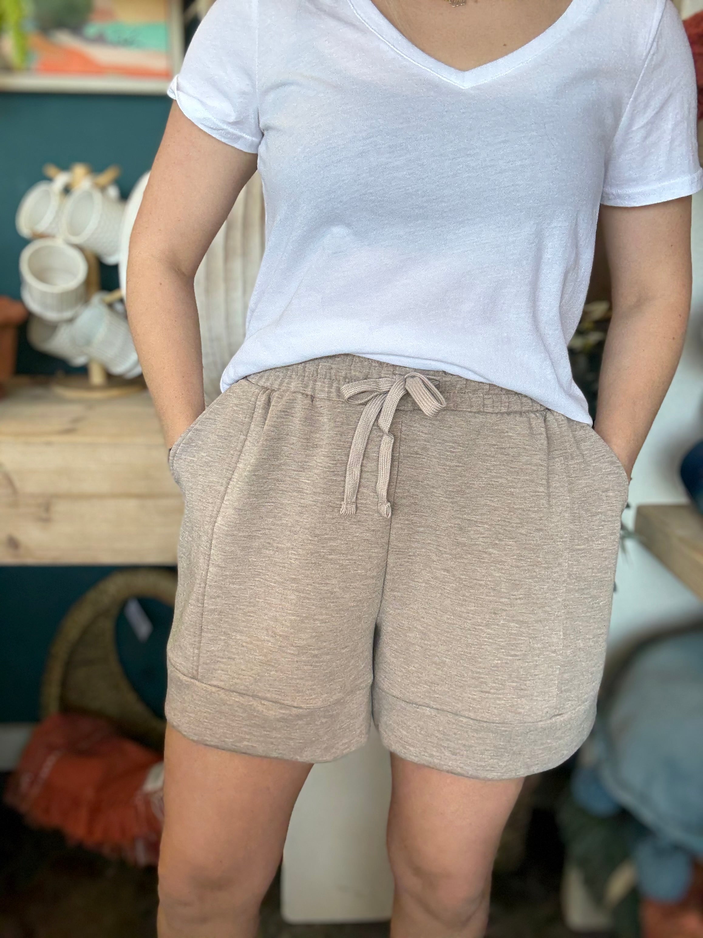 woman wearing neutral drawstring boutique lounge shorts with pockets