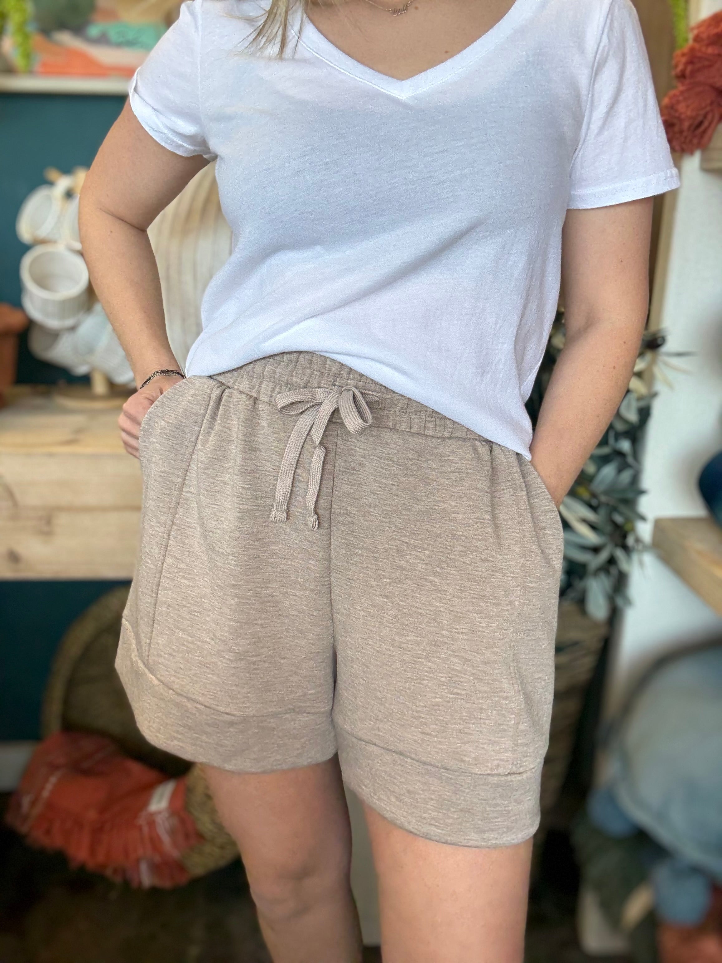 woman wearing neutral drawstring boutique lounge shorts with pockets