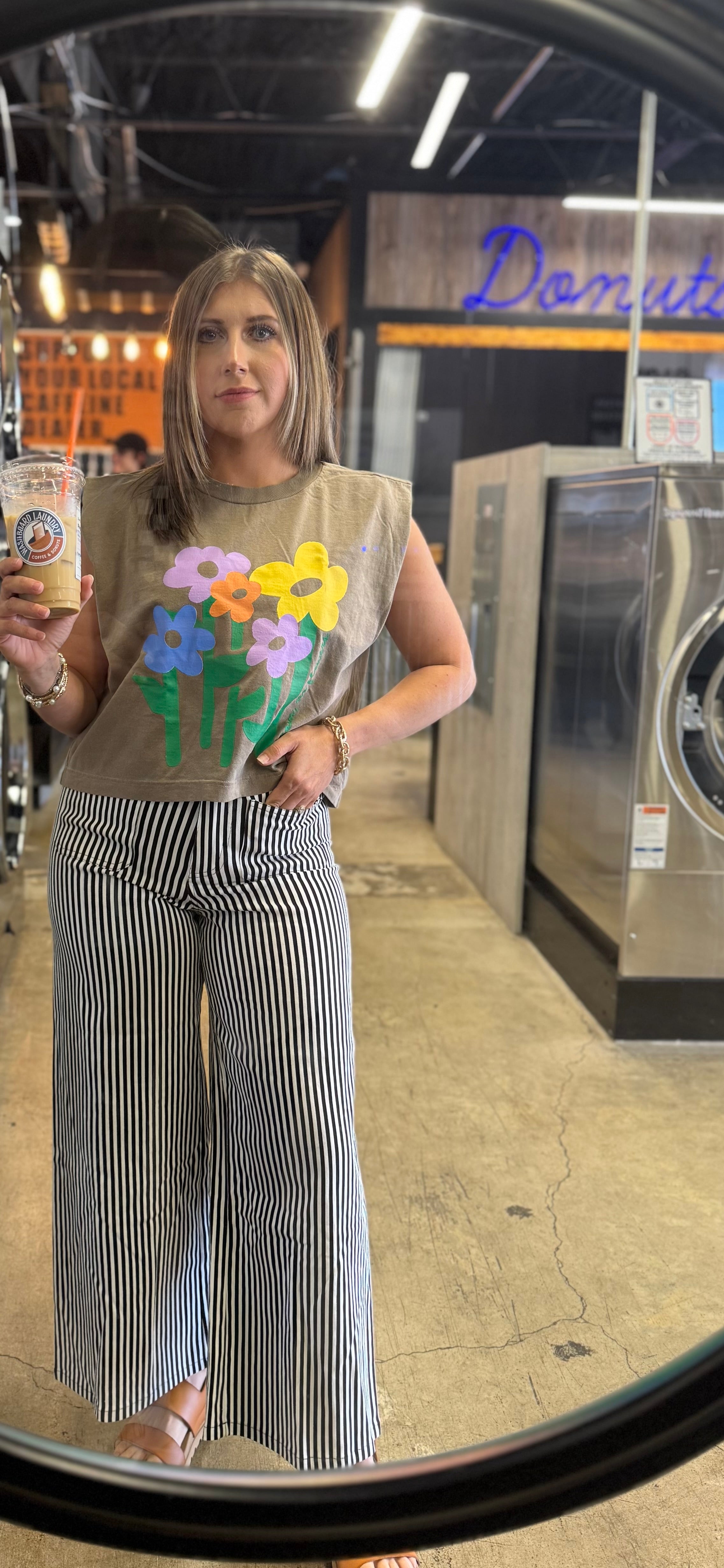 woman wearing black and white striped stretch wide leg pants with a relaxed fit