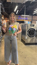 woman wearing black and white striped stretch wide leg pants with a relaxed fit