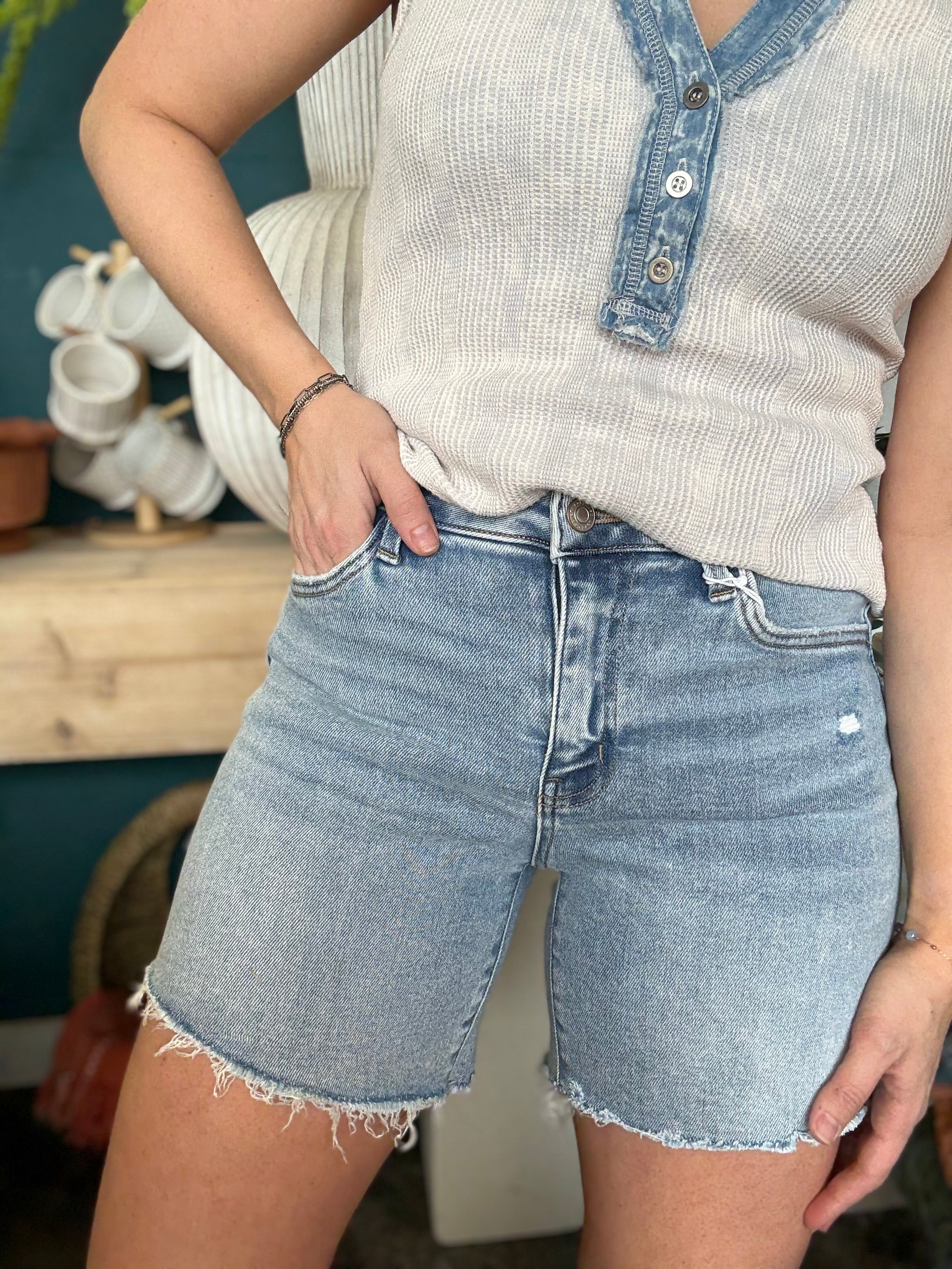 woman wearing vintage wash frayed hem denim boutique shorts