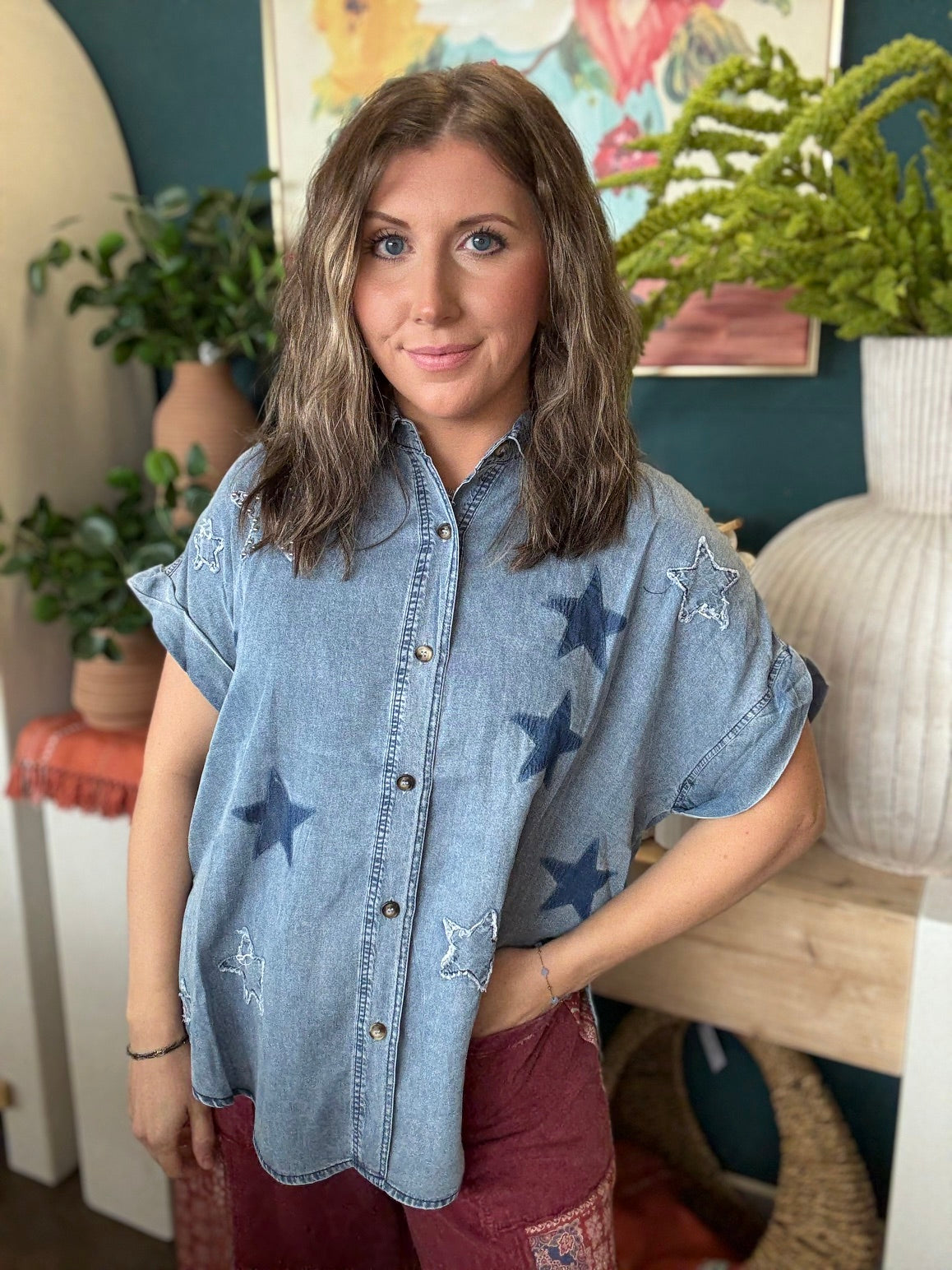 woman wearing vintage star wash denim oversized button-up boutique top