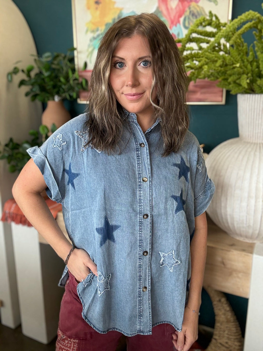 woman wearing vintage star wash denim oversized button-up boutique top