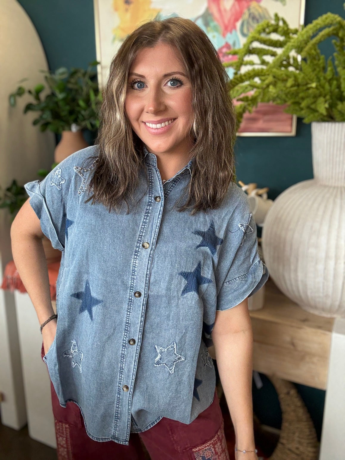woman wearing vintage star wash denim oversized button-up boutique top