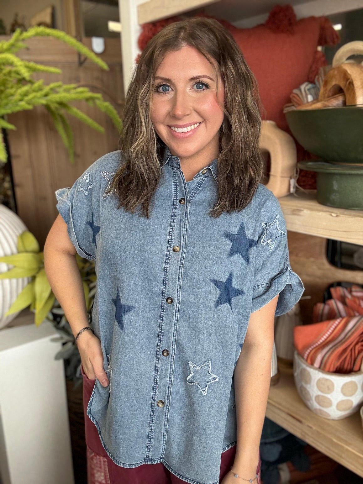 woman wearing vintage star wash denim oversized button-up boutique top