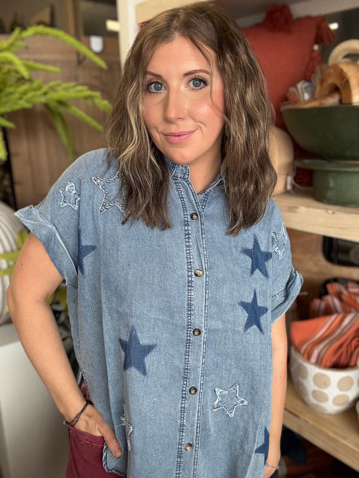 woman wearing vintage star wash denim oversized button-up boutique top