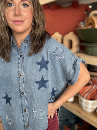 woman wearing vintage star wash denim oversized button-up boutique top