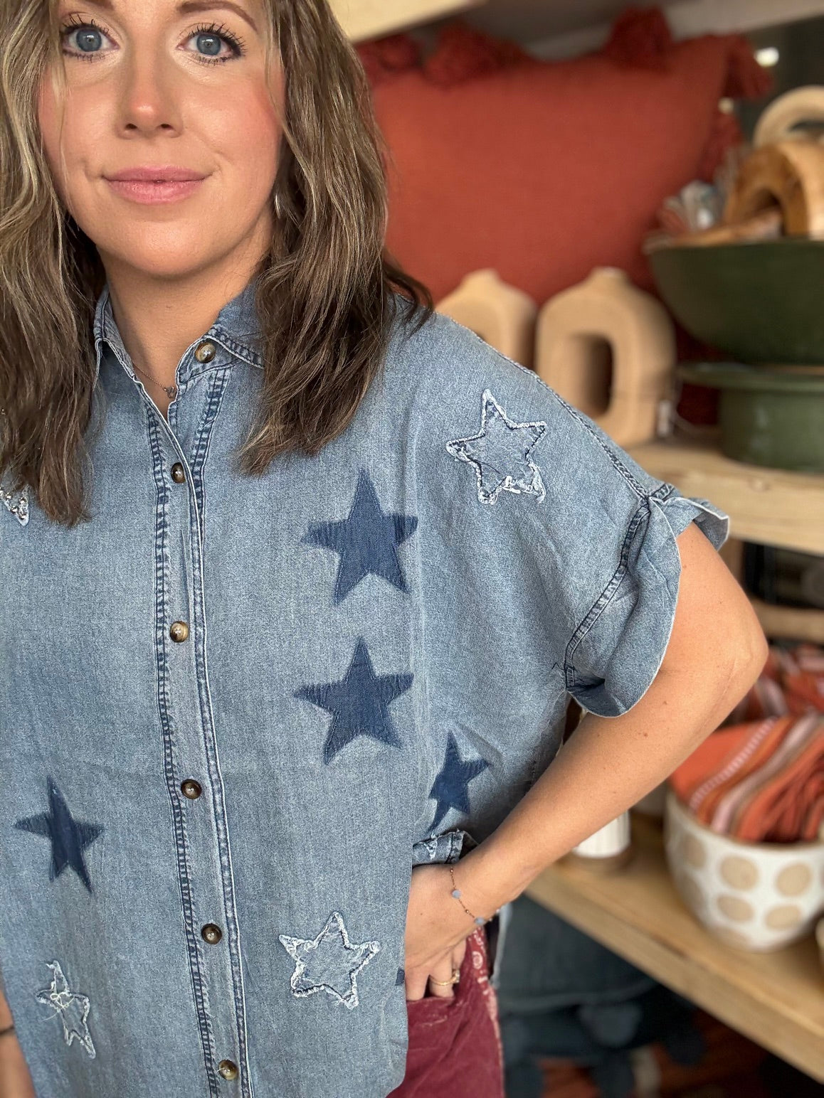 woman wearing vintage star wash denim oversized button-up boutique top