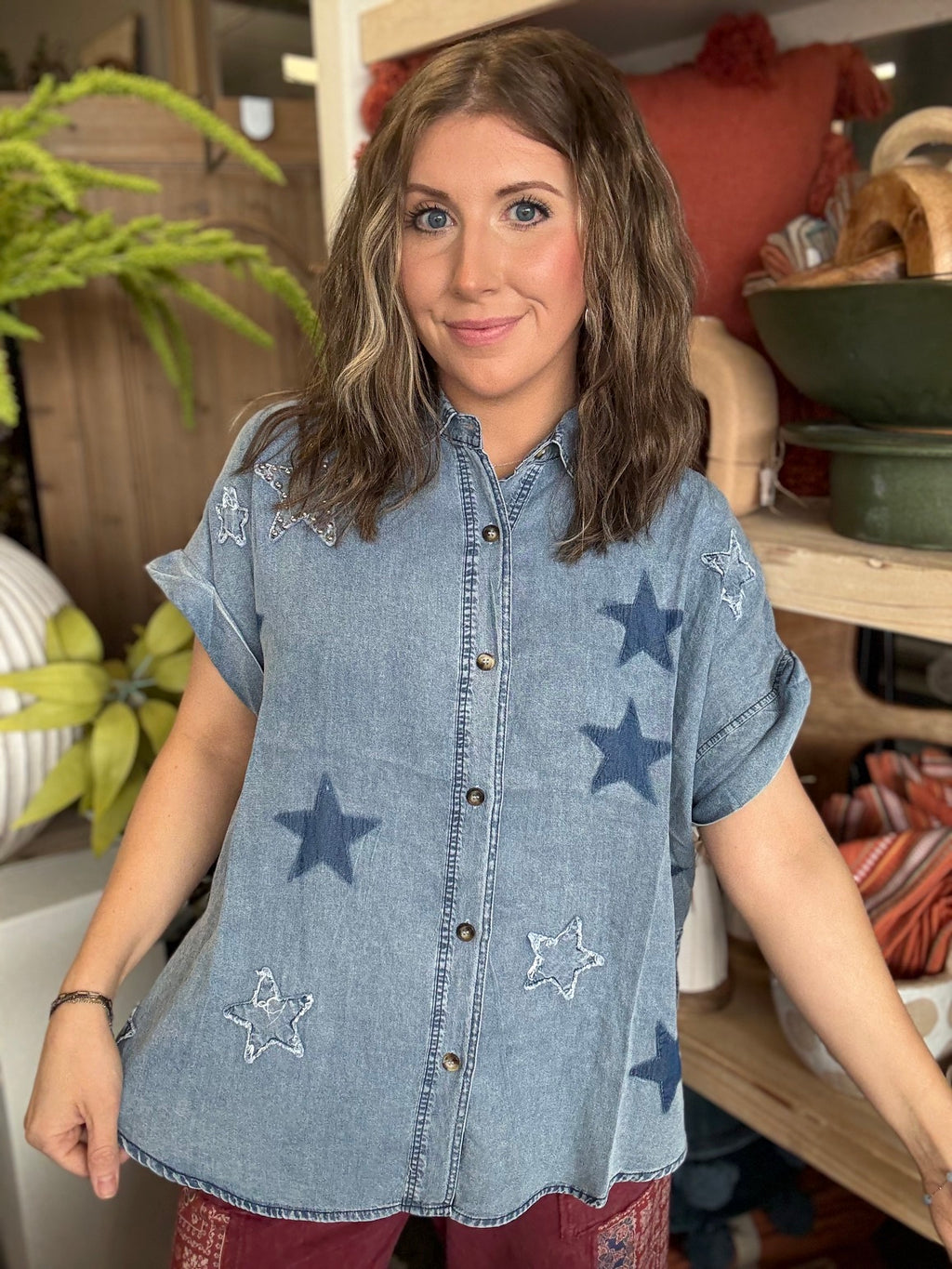woman wearing vintage star wash denim oversized button-up boutique top