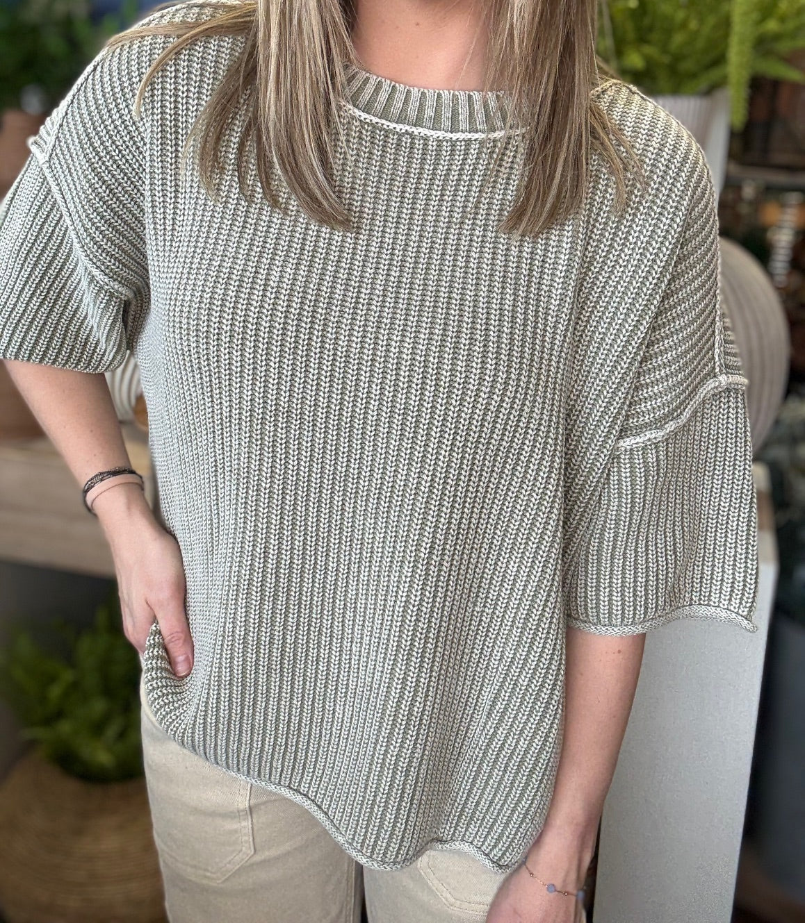 Sage ribbed knit short sleeve boutique top styled with neutral pants at Pill Box Boutique