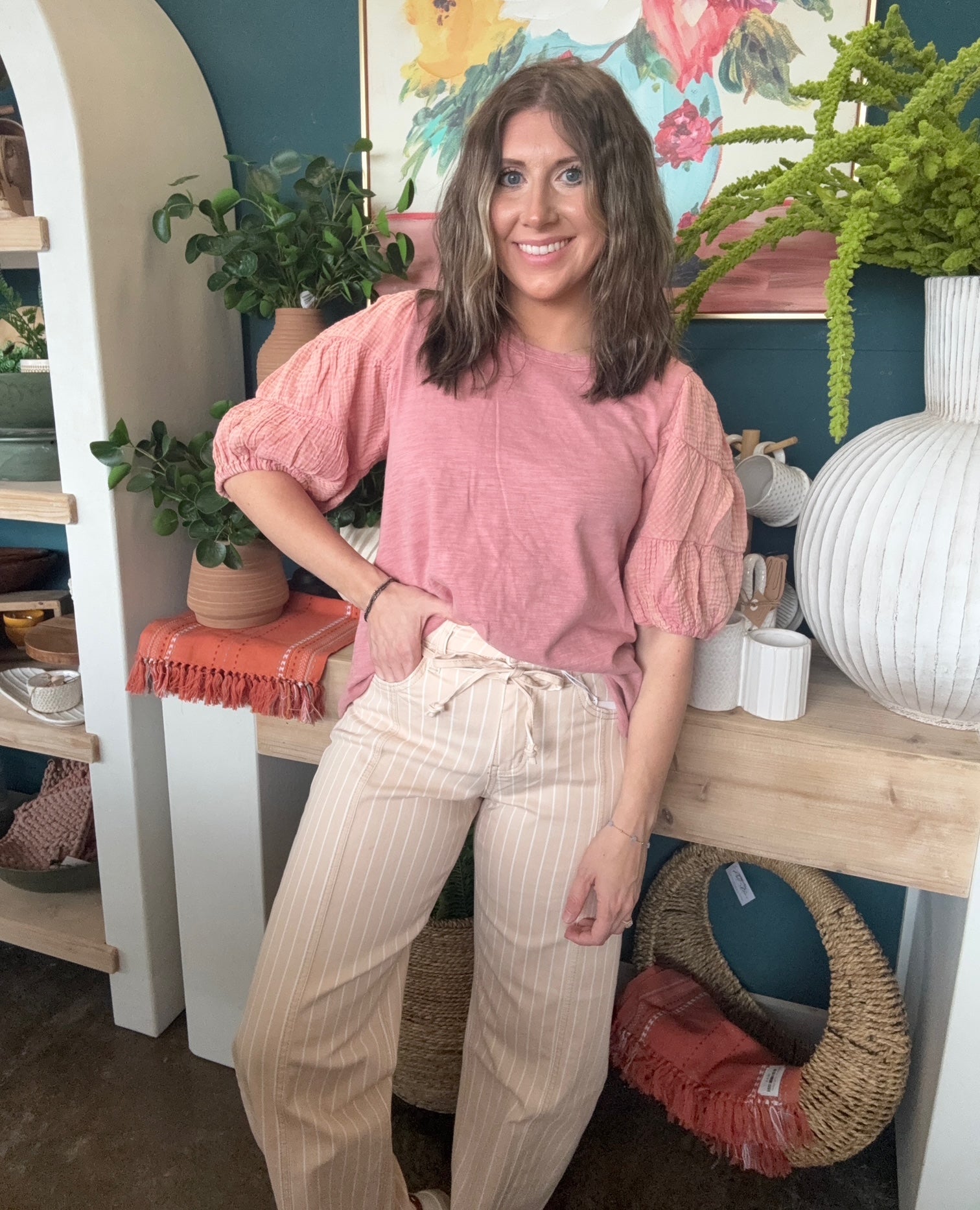 woman wearing sand striped drawstring boutique straight leg pants