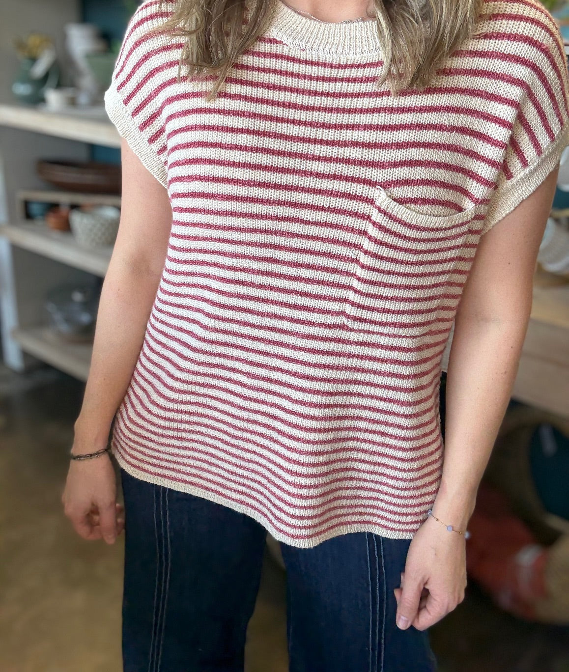 woman wearing red and cream striped boutique knit top with pocket