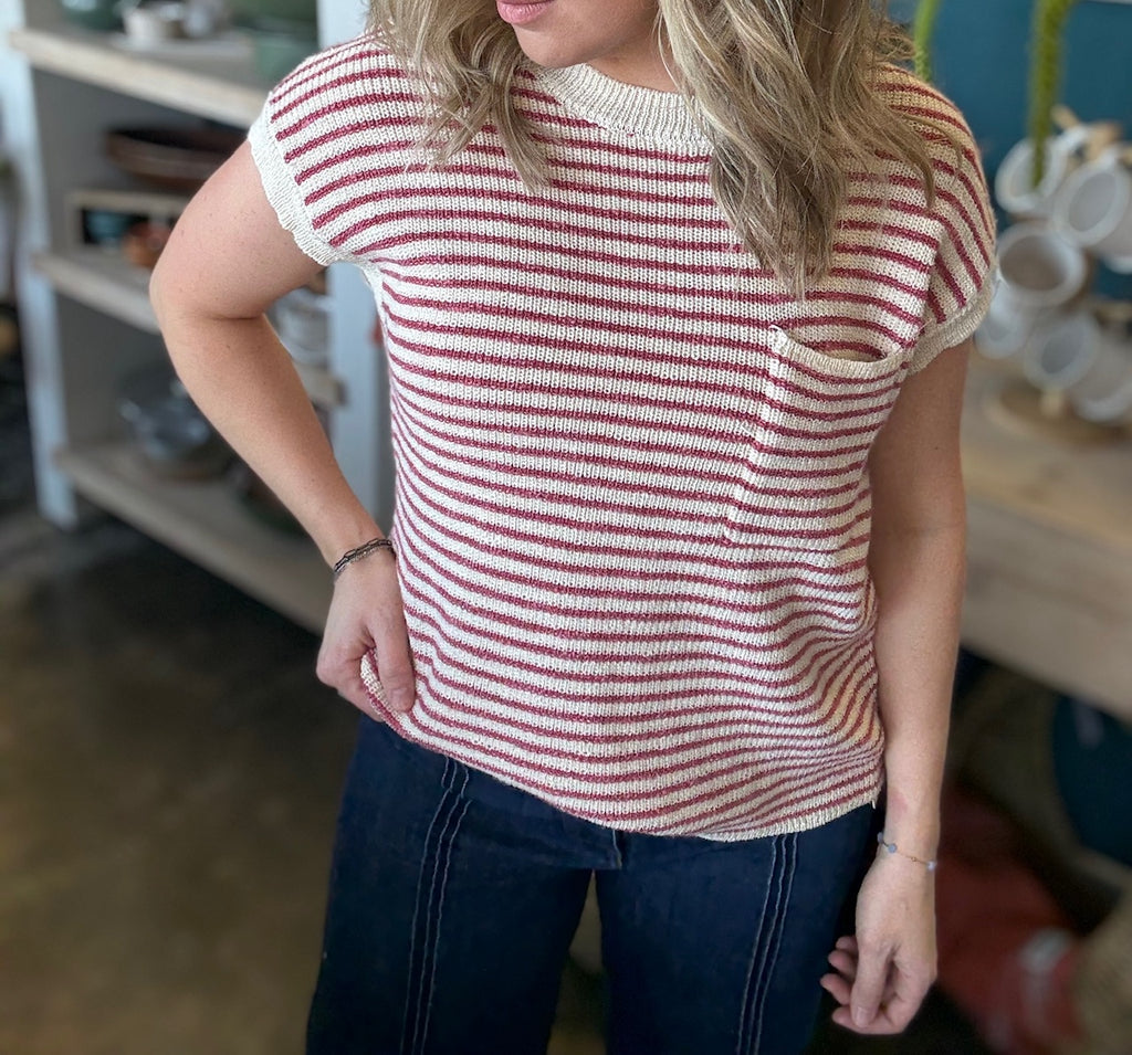woman wearing red and cream striped boutique knit top with pocket