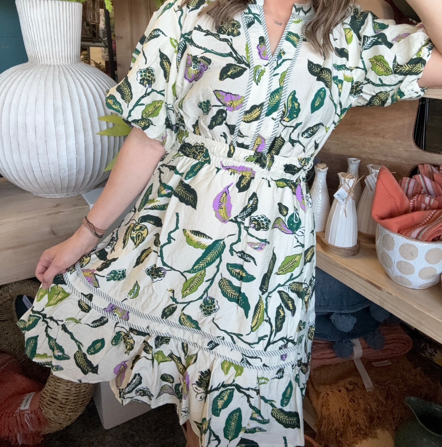 woman wearing woven botanical print mini dress with pockets